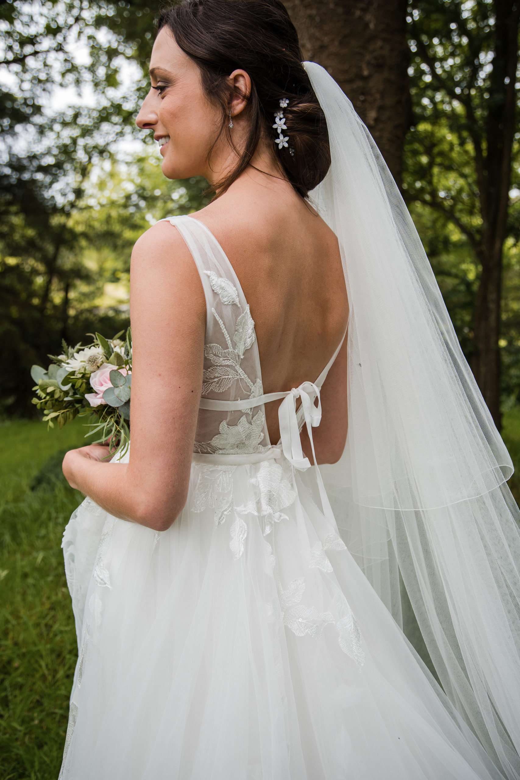 alison at her woodland wedding to matt