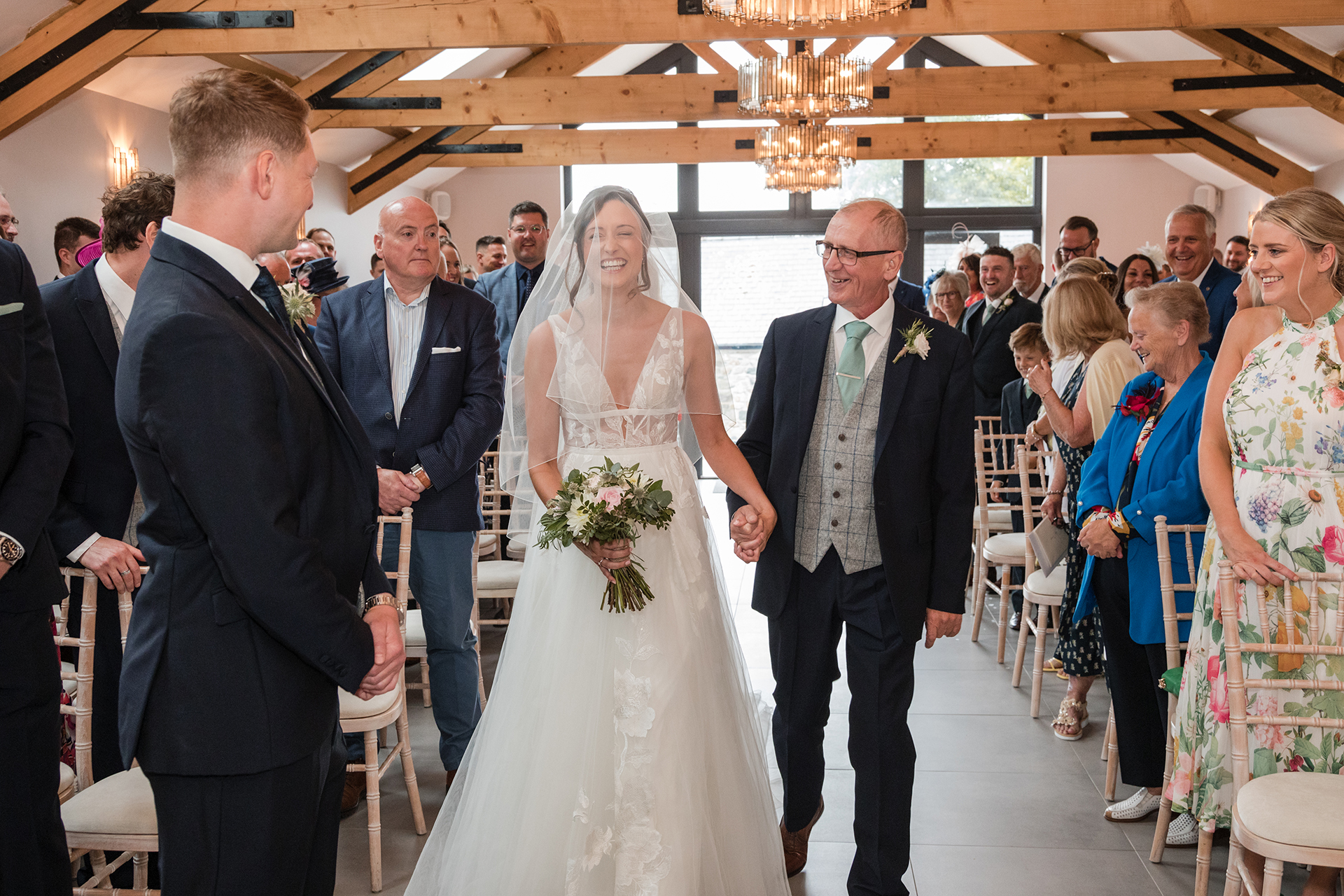 bride walking down the aisle at woodland wedding wales