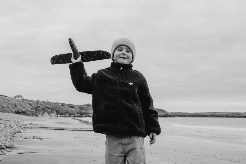 Stan was all about flying his toy plane across the sand – the joy of childhood in one photo.