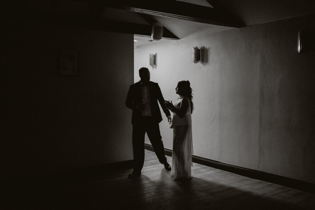 Couple photography by draped engagement dinner set up in Pembrokeshire 
