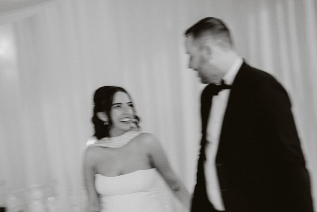 Couple photography by draped engagement dinner set up in Pembrokeshire 