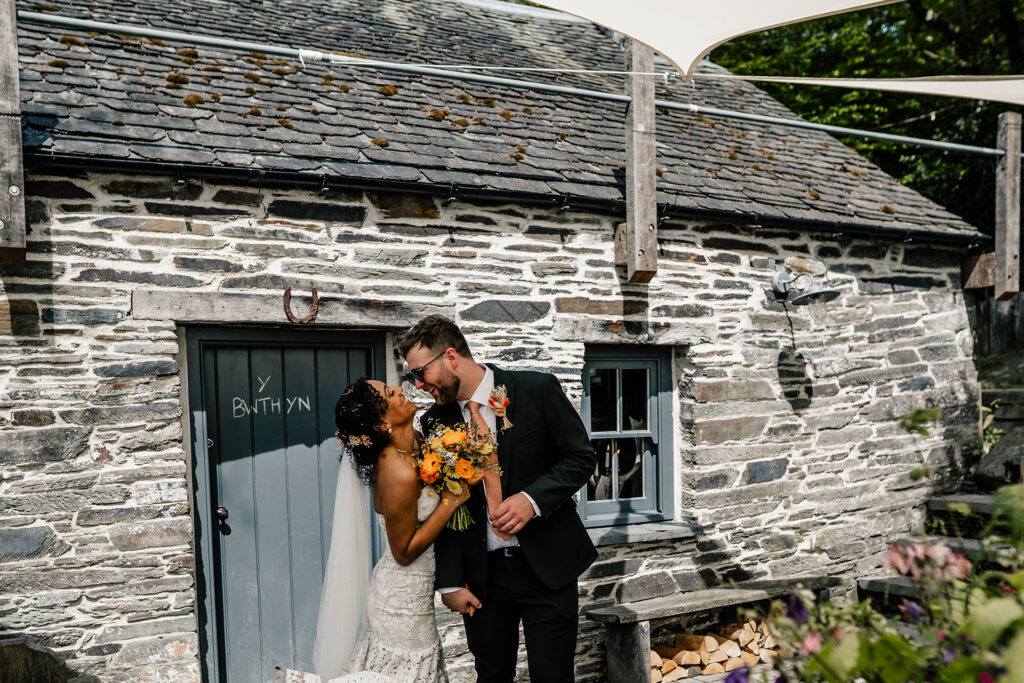 Married couple in front of the Bwthyn Pub at Fforest
