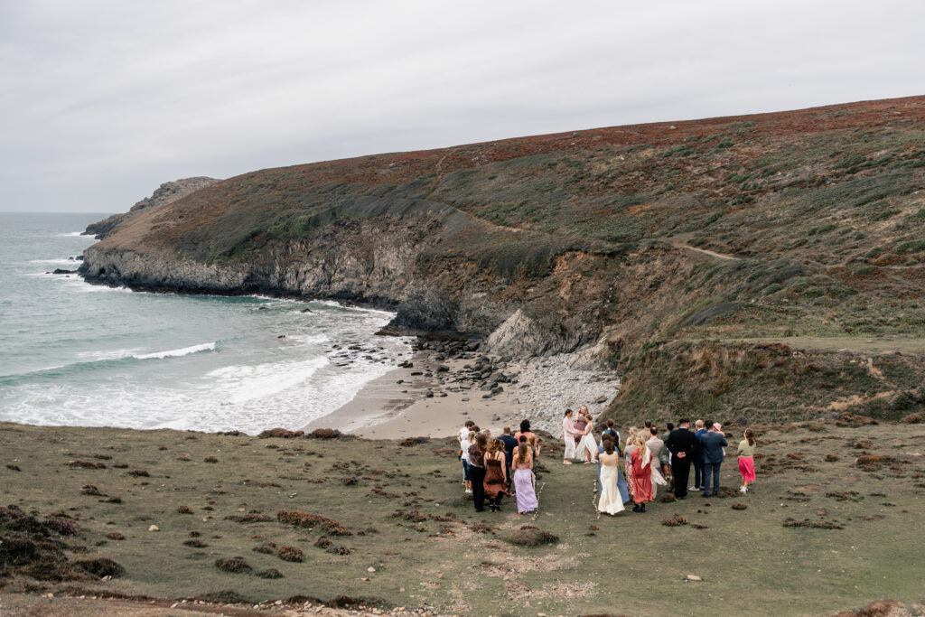 A pembrokeshire coast wedding ceremony. looking out to sea while couples say I do. 